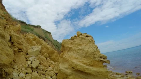 White Clouds over Rocky Beach Stock Footage 58209139