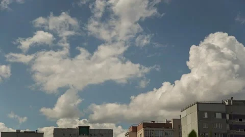 White clouds over the rooftops. Stock Footage 52194849