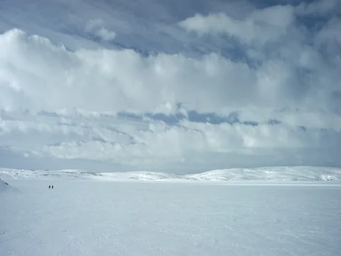 White clouds over snow covered landscape 库存影片 73284566