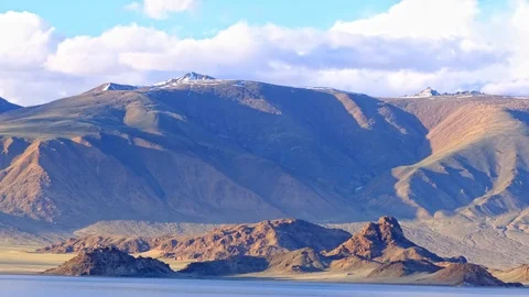 White clouds over snow mountain Видео 119893288