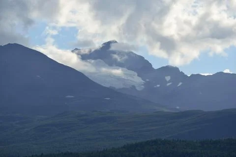 White clouds over summer mountain in sunshine Foto stock
