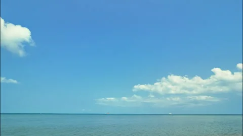 White clouds over tropical sea, time lapse Видео 331920065