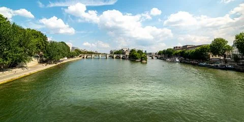 White clouds over world famous Seine river in Paris Stock Photos
