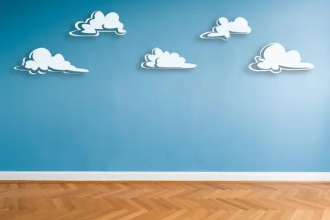 White clouds painted on blue wall in empty room  with parquet floor and copy  Stock Photos
