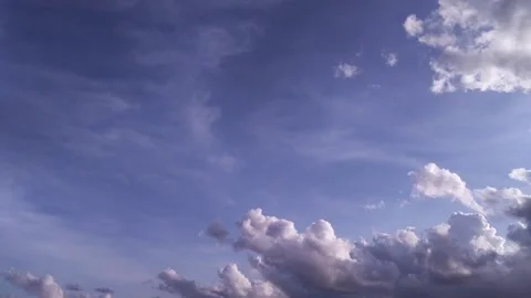 White Clouds Raising up in the Clear Blue sky HD Timelapse Stock Footage 134320003