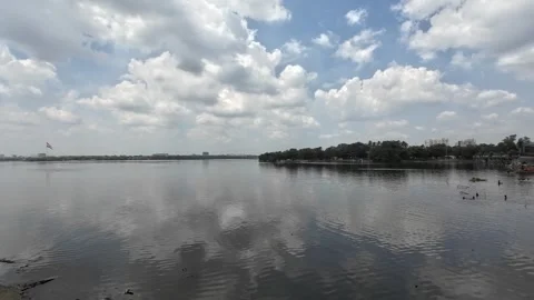 White Clouds Reflecting On Calm Water Lake During The Day Time Stock Footage 317927405