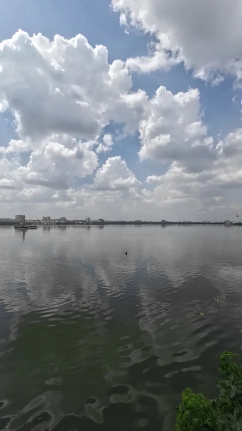 White Clouds Reflecting On Calm Water Lake During The Day Time Vertical Video Stock-Footage 317927738