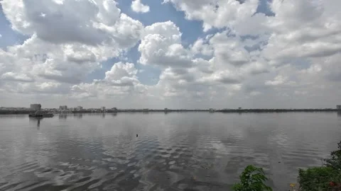 White Clouds Reflecting On Calm Water Lake During The Day Time Stock Footage 317928322