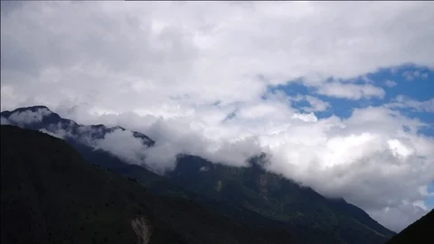 White Clouds Rolling Over Mountain [Timelapse] Stock Footage 88346223