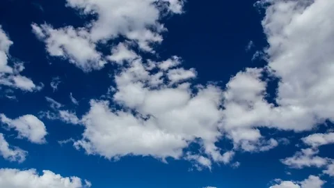 White clouds running across the blue sky. 4K.timelapse video Stock Footage 77626008