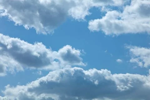 White clouds running over blue sky Фото