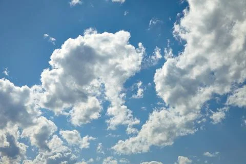 White clouds running over blue sky Stock Photos