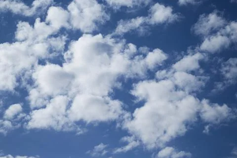 White clouds in the sky, fluffy cloud formations, sky with clouds Stock Photos