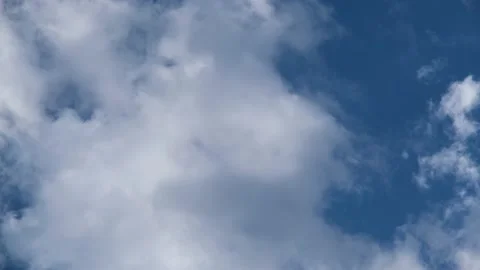 White clouds in the sky. Light clouds against the blue sky. Time Lapse Clouds Stock Footage 195535455