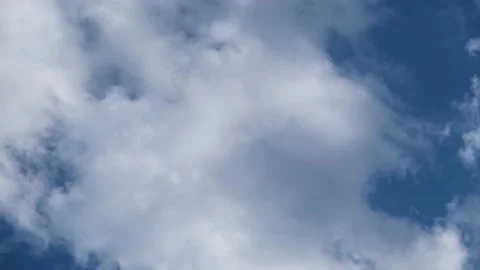 White clouds in the sky. Light clouds against the blue sky. Time Lapse Clouds Stock Footage 196696641