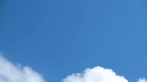 White clouds in the sky. Light clouds against the blue sky. Time Lapse Clouds Stock Footage 197079928