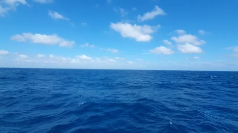 White clouds sky over the sea 動画素材 336357576