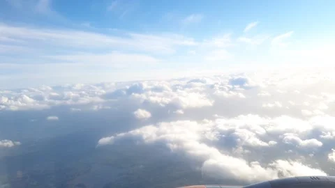 White Clouds in Sky from Plane Window Stock Footage 230913791