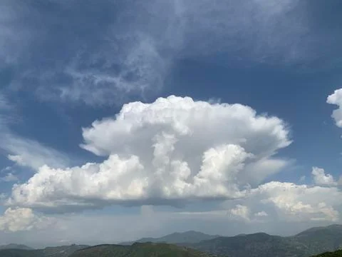 White clouds in the sky right before the storm Stock Photos