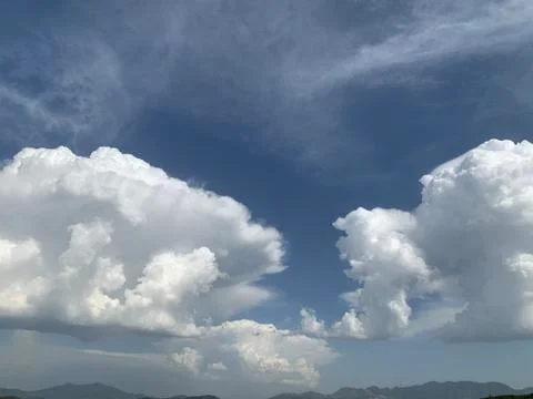 White clouds in the sky right before the storm Stock Photos