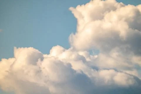 White Clouds in the Sky at Sunset Stock Photos