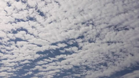 White clouds slowly float with a blue sky. Daytime sky time lapse 4k video. Stock Footage 289294849