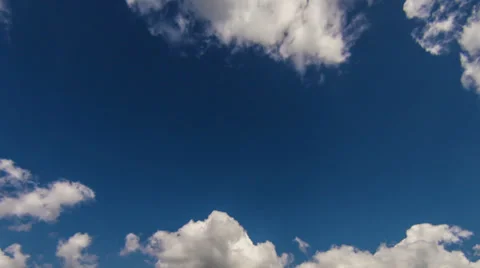 White clouds slowmotion timelapse on the blue sky Stock Footage 27968076