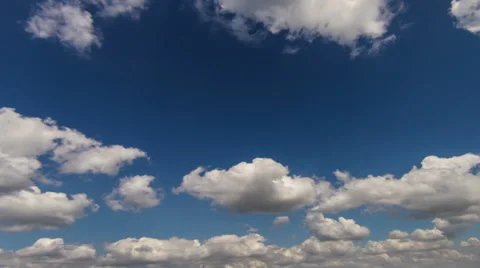 White clouds slowmotion timelapse on the blue sky Stock-Footage 27968869