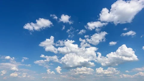 White clouds In sunny sky 4K timelapse Stock Footage