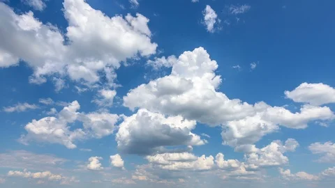 White clouds In sunny sky 4K timelapse Stock Footage 99437564