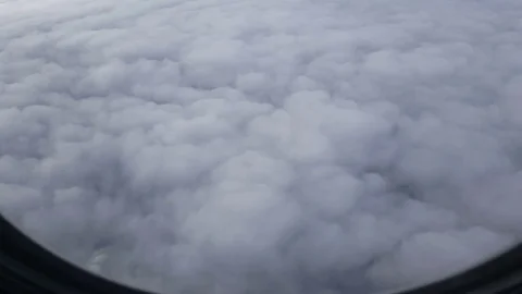White clouds through plane window Видео 74984761
