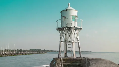 White Coastal Lighthouse on the Pier at Raa, Sweden Stock Footage 343862187