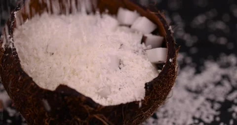 White coconut pulp and dried coconut flakes, a close-up of which is used in the Stock Footage 276453241