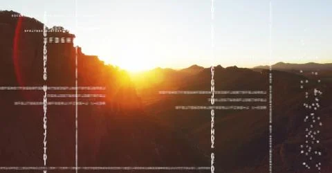 White code against mountain and sunset 写真素材