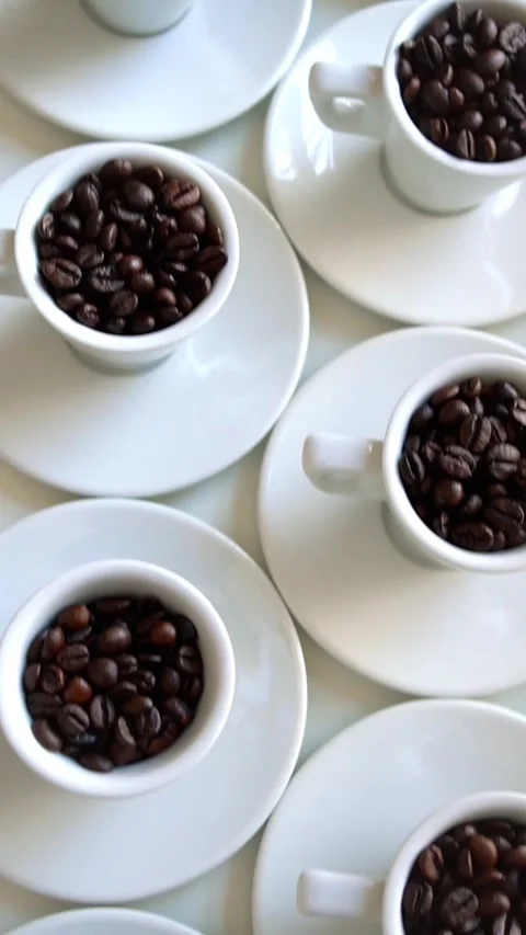 White coffee cup with coffee beans  on table, Rotating, Coffee concept, top view Stock Footage 281791781