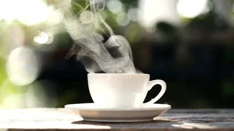White coffee cup, mug with steaming smoke of coffee on old wooden table Stock Footage 227170596