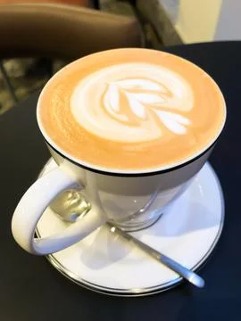 A white coffee cup on a table black coffee, cappuccino Stock Photos
