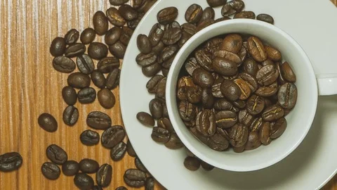 White coffee cup on wood table top view Stock Footage