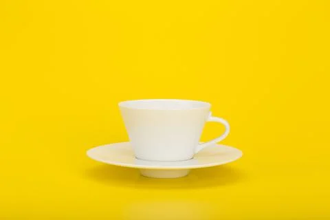 White coffee cup on yellow background with space for text Stock Photos