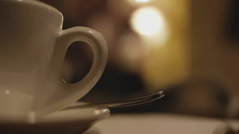 White coffee cup in yellow light 스톡 동영상 162235984