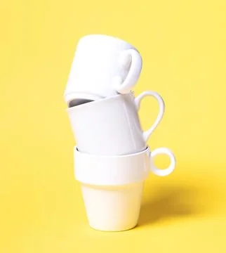 White coffee cups isolated on a solid background Stockfoto's