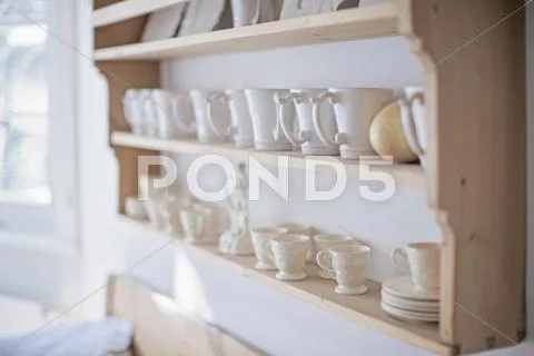White Coffee Cups On Kitchen Shelf