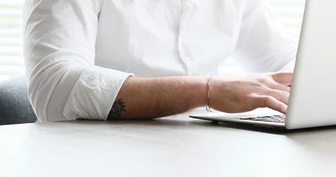 White collar bearded man typing then watching outside Stock Footage 89673330