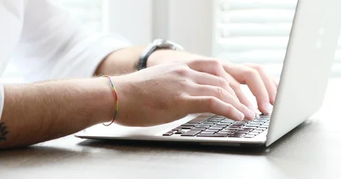 White collar bearded man typing then watching outside Stock Footage 89673694