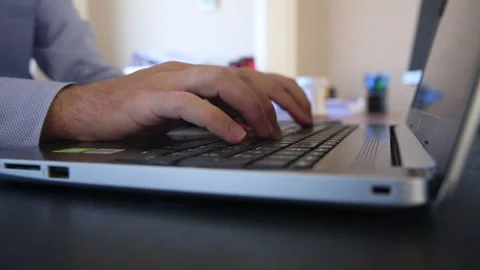 White collar office worker working on laptop in office environment Stock Footage 159048433