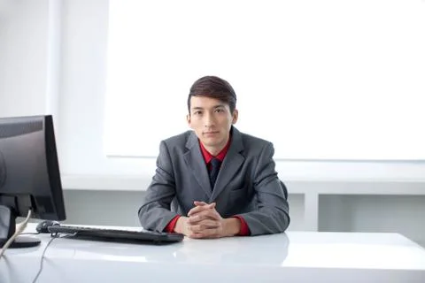 A white-collar worker is busy working in the office Stock Photos