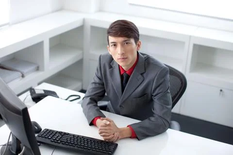 A white-collar worker is busy working in the office Stock Photos