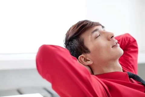 A white-collar worker takes a break in an office Stock Photos
