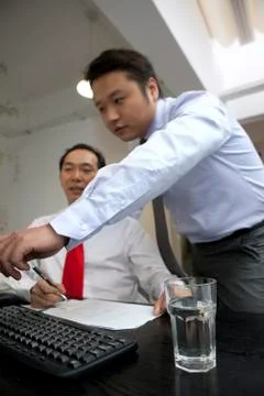 White-collar workers are busy working in the office Stock Photos