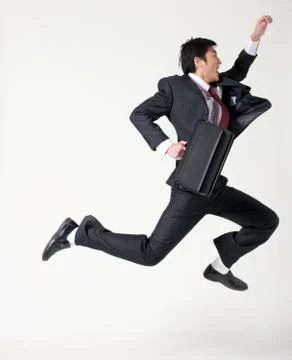 White-collar workers Jump Work hard Full body. Oriental figures 20 to 30. Stock Photos